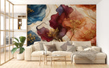 Large abstract watercolor floral wall mural in earthy terracotta and blue tones, styled in a modern living room with a white sofa.