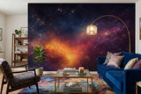 Vibrant deep space nebula wall mural with orange and purple cosmic dust, available in peel and stick and non-woven wallpaper options
