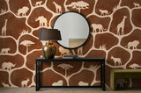 Wood Maker Deco African Safari Animals Silhouette Wallpaper featuring giraffes, lions, elephants, and rhinos on a brown background.