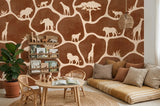 Wood Maker Deco African Safari Animals Silhouette Wallpaper featuring giraffes, lions, elephants, and trees on a brown background. Ideal for a nursery or playroom.