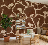 Wood Maker Deco African Safari Animals Silhouette Wallpaper featuring giraffes, elephants, lions, and rhinos on a brown background. Ideal for a child's room.